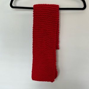 Bright red knitted scarf